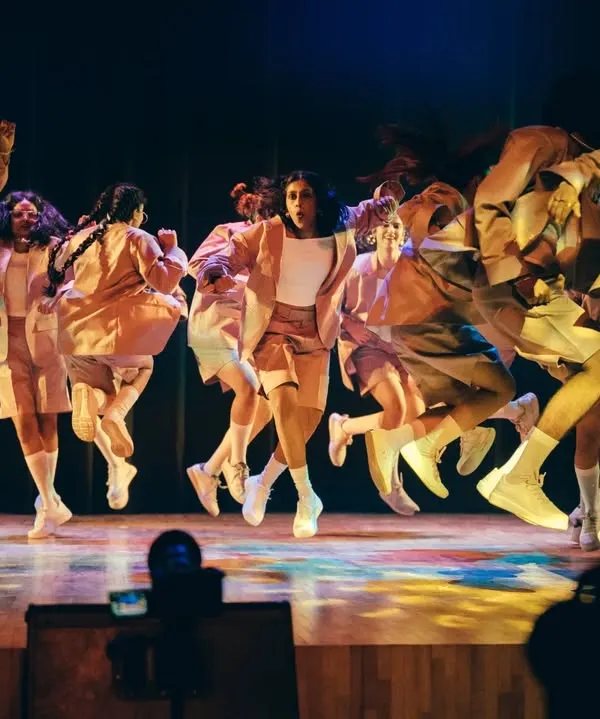 The energy in the air is electric as our dancers take flight. This mid-air shot from Performance Night captures the explosive power and synchronization of our crew.