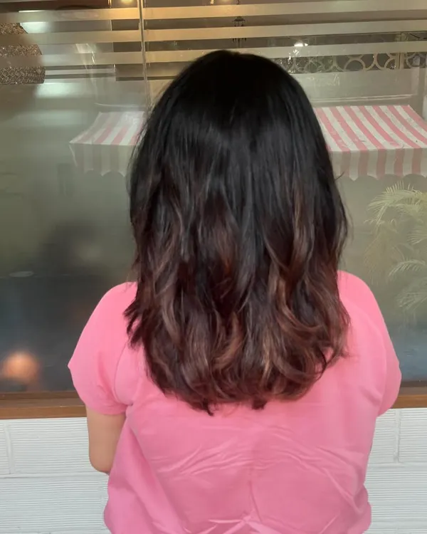 This is a restyle for Sheela. I cut off her previously color-damaged ends and gave her a healthy, medium-length cut with a soft ombre effect that looks intentional and stylish.