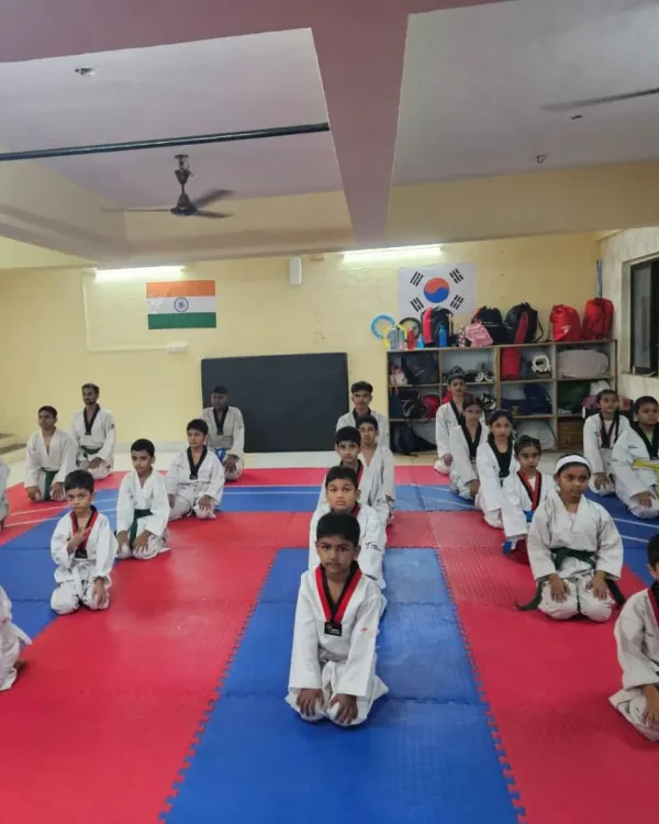 A moment of calm and focus. Our students kneel in formation, showing the discipline and respect that is central to our teaching philosophy.