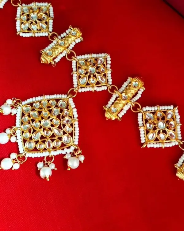 My restocked Sheeshpatti with an attached Mangtika. This all-in-one hair accessory provides a complete and regal look without needing separate pieces.