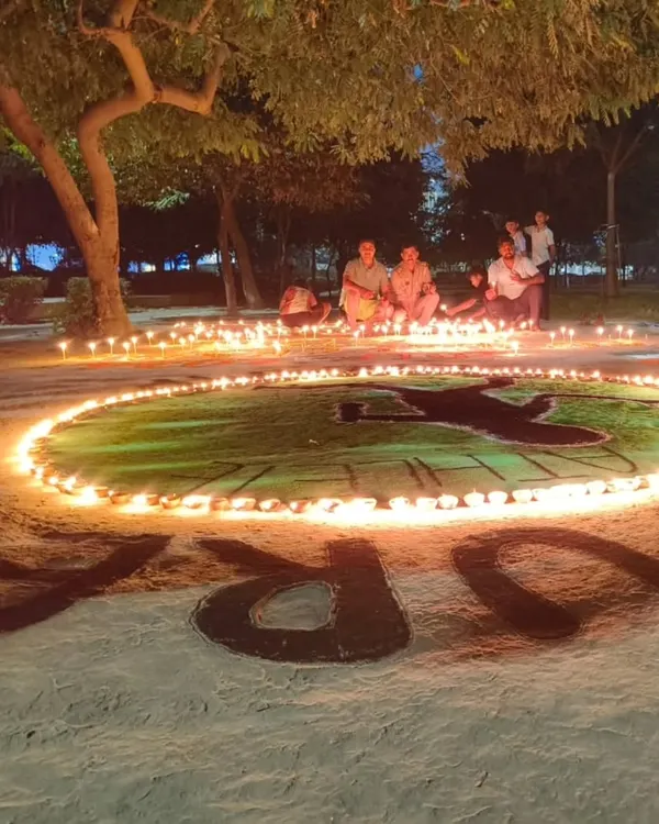 Celebrating Diwali with my students in a Noida park. We created this rangoli of an athlete, surrounded by diyas, to honor our shared passion for fitness.