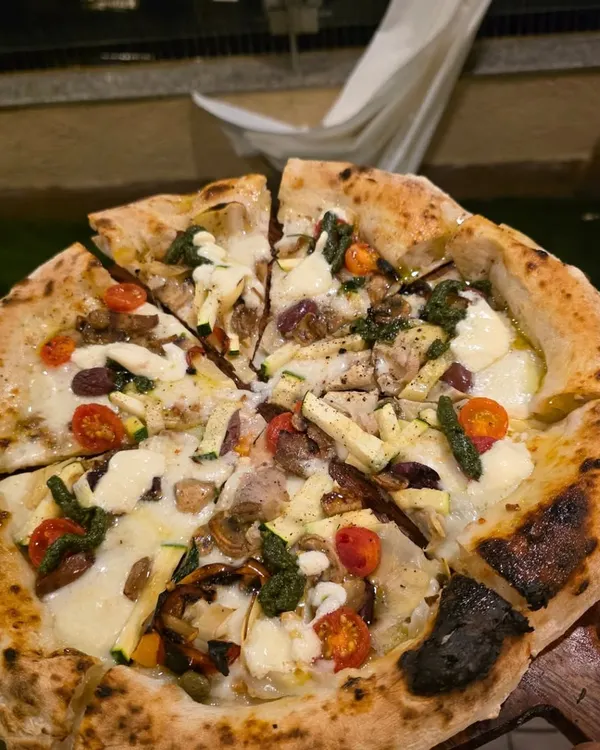 A shot from a fantastic birthday pizza party I catered. There's nothing like serving fresh, hot Neapolitan pies straight from the oven to a happy crowd. I can set up my pizza station indoors or outdoors for any private catering event in the Mumbai area.