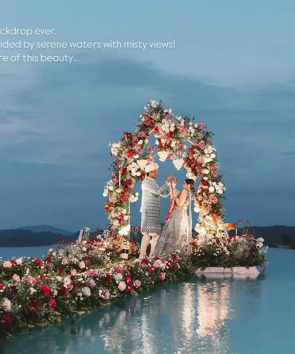 At the most beautiful setting, we witnessed the magical moments of Supreetha and Adithya's life. For their sundowner Varmala ceremony, we built a floral stage right in the middle of an infinity pool, surrounded by misty mountains and overlooking a serene lake.