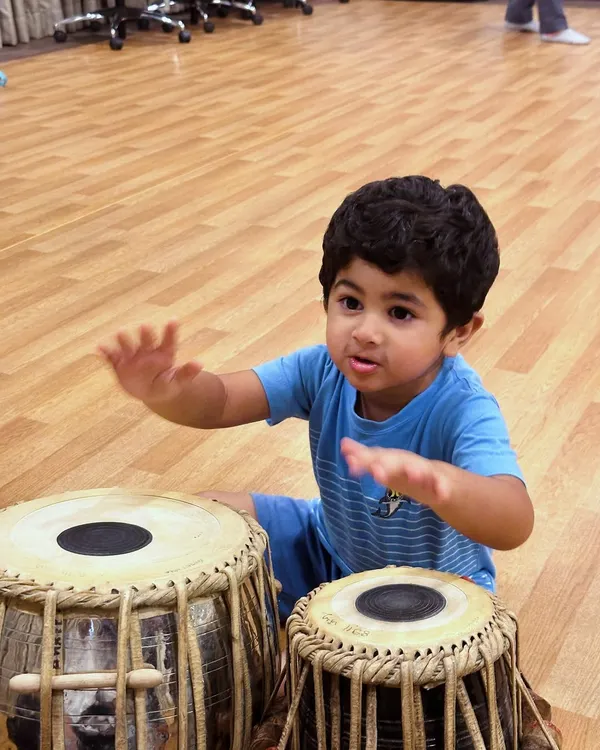 This is where the magic begins. We believe in a hands-on approach, letting even our youngest students feel the rhythm and connect with real Indian classical instruments like the tabla. It’s about sparking curiosity and building a love for music from the very first beat.
