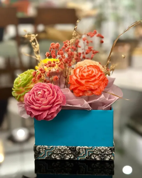 This is my candle flower bouquet, a perfect gift that never wilts! It features a variety of colorful, hand-carved rose candles arranged in a beautiful gift box.