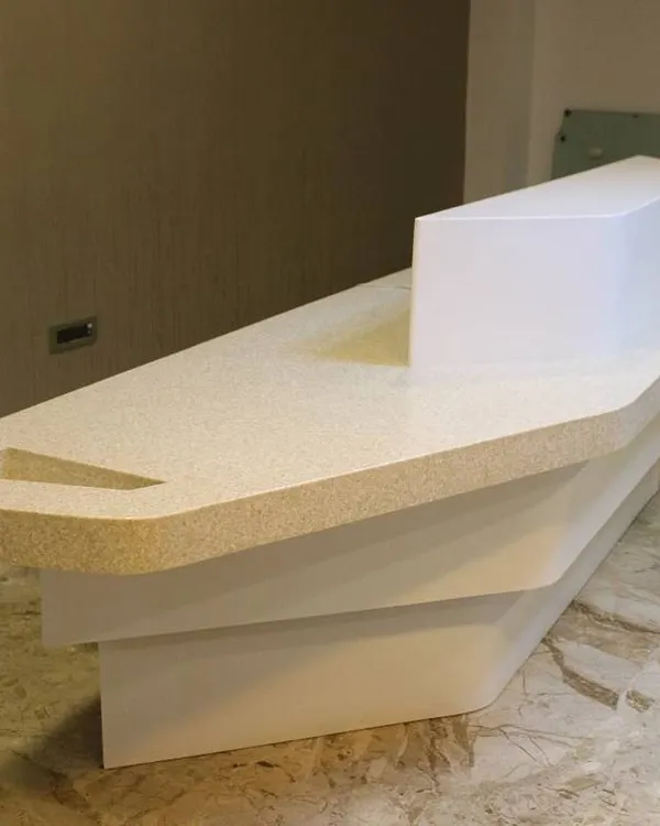 This custom-designed reception table for the Hotel Priyadarshini in Hospet features a futuristic, layered form. Its sculptural quality makes a strong first impression, setting a modern and sophisticated tone for the entire establishment.