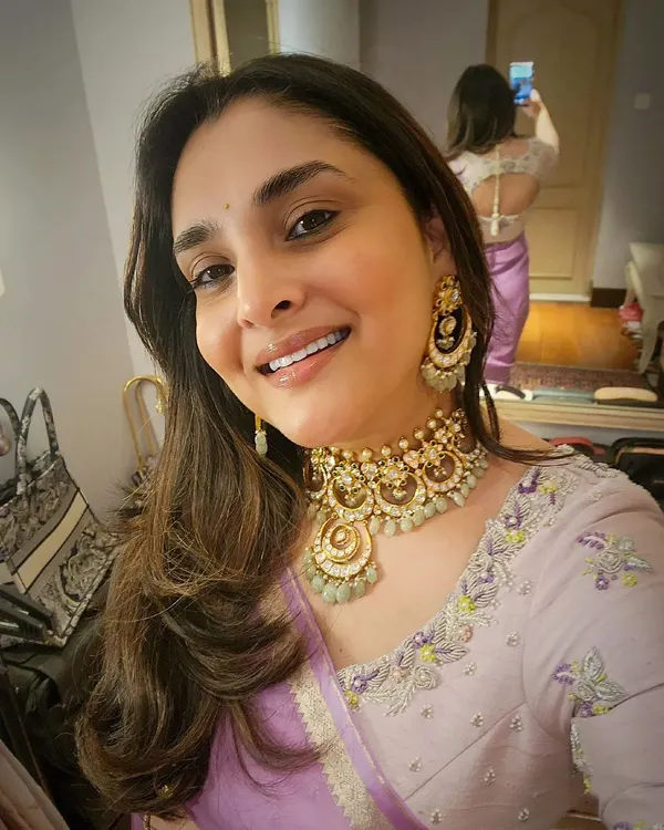 A happy selfie from the Sandalwood Queen, Divya Spandana. Seeing her smile while wearing my creation makes my heart truly full. This image shows the front of her pastel raw silk blouse with delicate spring flower embroidery, which we designed together to match her lilac chiffon saree.