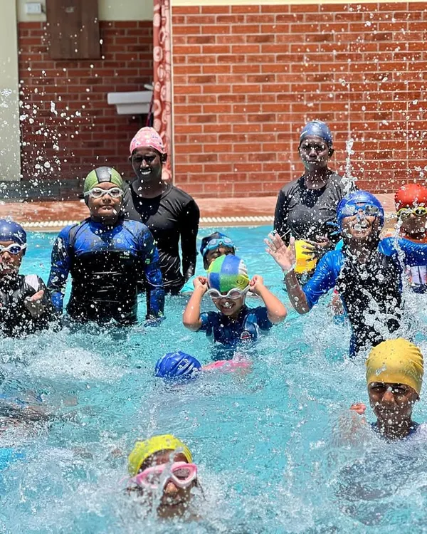 A snapshot of the energy and fun from one of our regular swimming classes. You can see our coaches right in the water with the kids, making a splash and learning together.