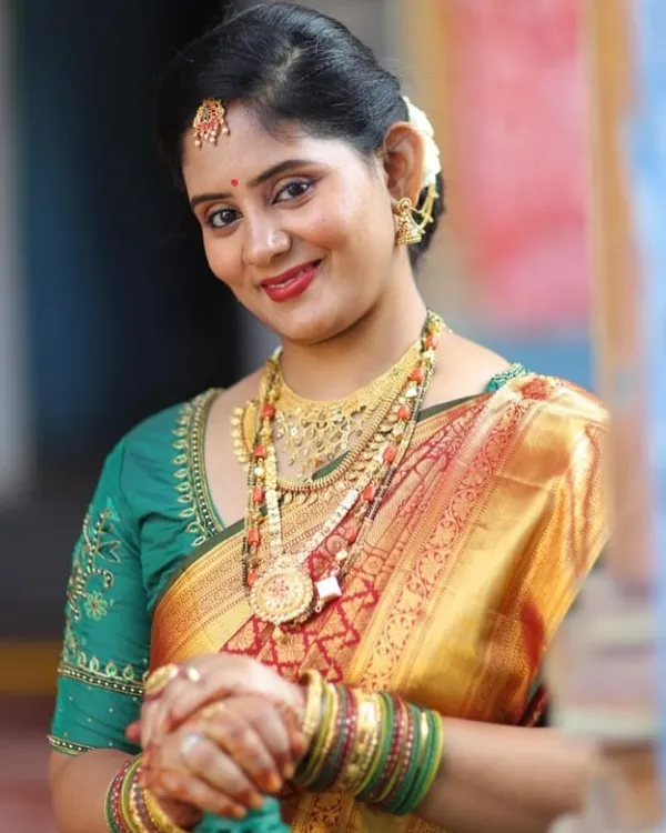 Pavithra looking radiant for her son's Upanayana. This look features classic temple jewelry and a traditional silk saree, which I complemented with a timeless makeup look.