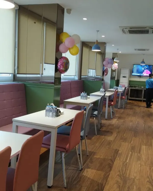 A view of our indoor café area, with comfortable booth seating and tables ready for guests.