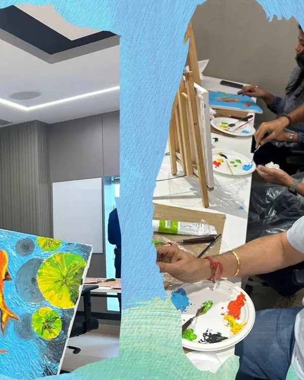 A corporate art session in full swing. My workshops are designed as a perfect employee engagement activity, helping teams bond while creating textured koi fish paintings.