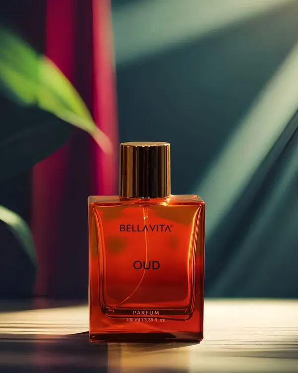 A creative shot of a perfume bottle, using dramatic lighting and shadows to create a sense of luxury and mystery. This style of product photography is perfect for high-end brands and ad campaigns.