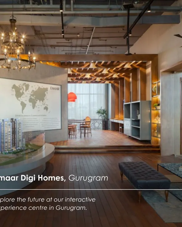 The Emaar Digi Homes Experience Centre in Gurugram, designed as an interactive and welcoming space. The layout combines a model display, lounge seating, and a raised cafe area, guiding visitors through a warm, wood-clad environment.