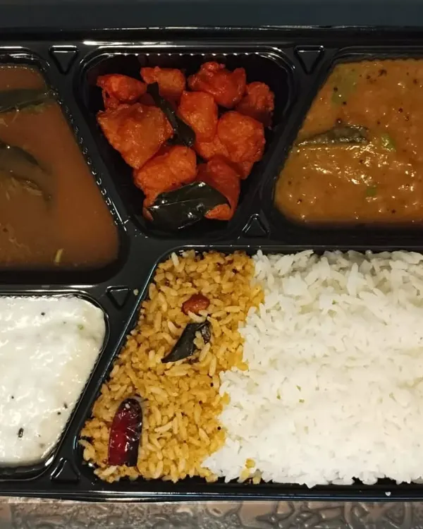 My combo special veg meal, perfect for when you want a bit of everything. This thali has Gunpowder Rice, plain rice, dal, rasam, Aloo 65, and curd rice.