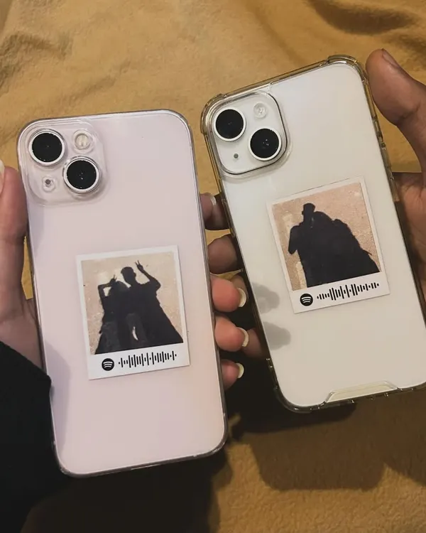 Turn your phone into a personal memento. These mini polaroid stickers feature a silhouette illustration and a scannable Spotify code that plays your special song, designed to fit perfectly on the back of a phone case.