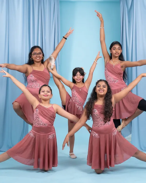 Our talented young dancers striking a pose in their beautiful costumes. We focus on grace, technique, and teamwork in our kids' contemporary and jazz classes.