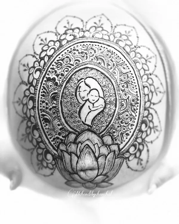 A black and white shot of the mother and child belly henna I created. The monochrome effect highlights the intricate line work and the emotional core of the design.