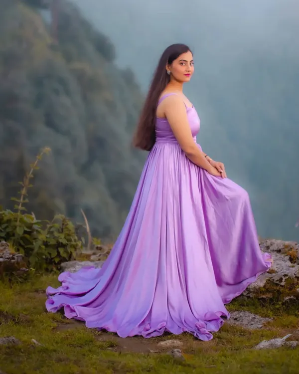 This custom lavender gown was designed for a client's fairytale pre-wedding shoot. I created a long, gathered skirt with lightweight fabric to catch the mountain breeze, making for truly magical photos. The simple spaghetti strap bodice keeps the focus on the dress's beautiful color and flow.