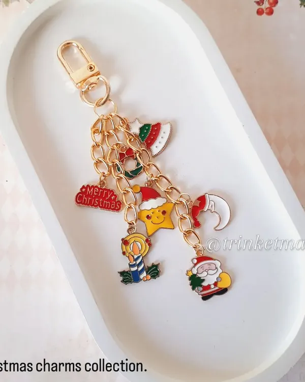 My Christmas charm collection is here. This keychain is loaded with festive charms like Santa, a Christmas tree, a stocking, and more. It's a perfect stocking stuffer.