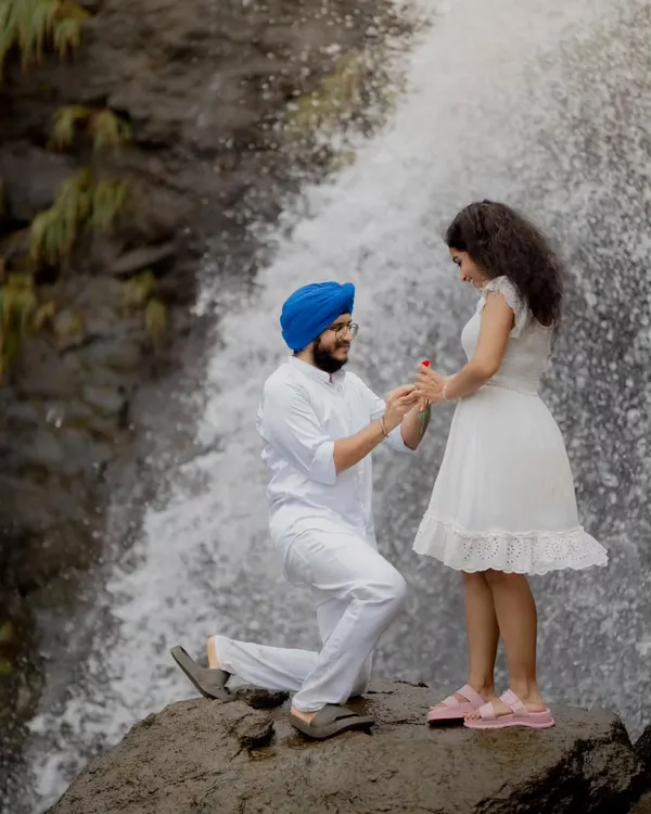 A perfect proposal moment captured during a pre-wedding shoot at a breathtaking waterfall. These sessions are ideal for telling your story in a unique, natural environment.
