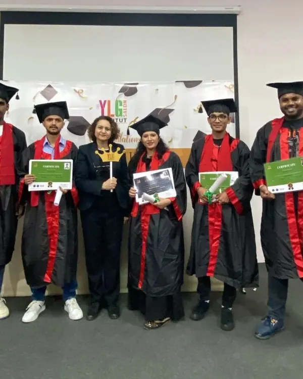 A group of our recent graduates in their ceremonial gowns, proudly holding their hard-earned certificates. They are now certified professionals ready for the industry.