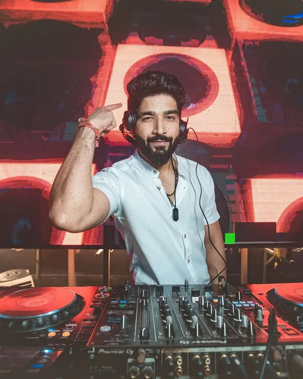 In my element, reading the room and getting ready to drop the next track. This is the focus I bring to every set, ensuring the energy never dips.