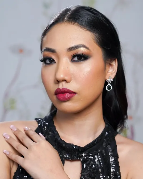 A classic party look featuring a smoky eye and bold lip, perfectly balanced with voluminous lashes. The lashes add just the right amount of drama, making the eyes the main focus.