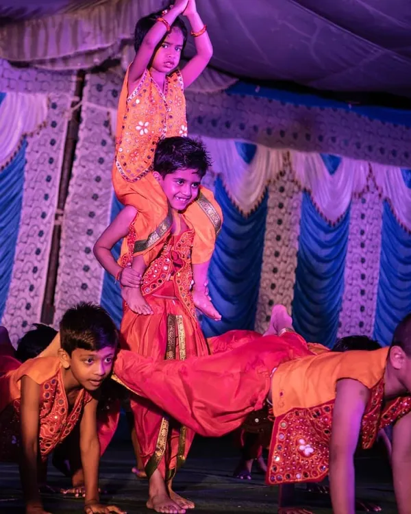 Look at the focus and teamwork from my amazing kids during their Ganesh Chaturthi performance. I choreograph routines that are not only fun but also include impressive moves like this human pyramid, helping them shine on stage.