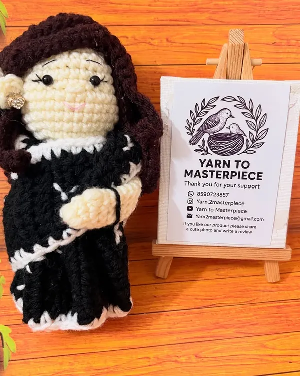 A closer look at a custom doll I made, based on a client's photo. I focused on recreating the details of her black and white saree and her hairstyle, complete with a tiny, sparkling ring.