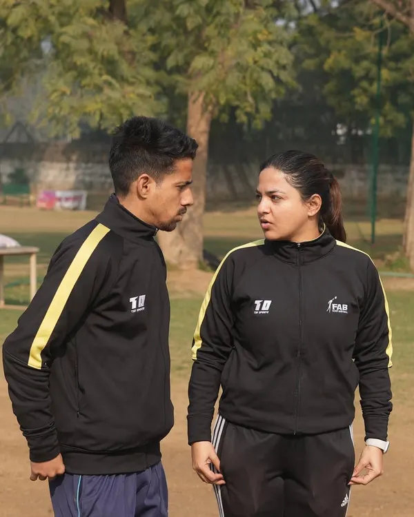 A moment of discussion and strategy between our founder and a fellow coach. At our academy, coaching is a collaborative effort focused on shaping character and nurturing resilience.