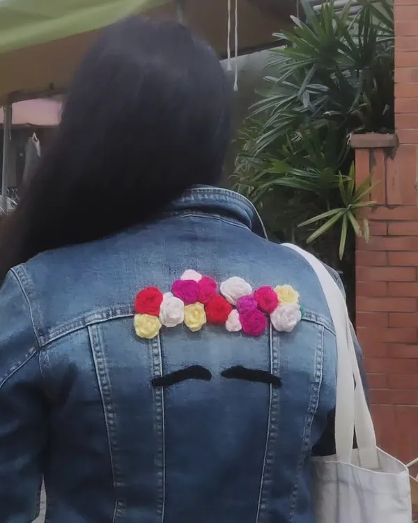 This old denim jacket was just sitting in my closet, but I couldn't let it go. Inspired by one of my favorite artists, Frida Kahlo, I gave it a new story with this crocheted flower hairdo. It’s now a piece of wearable art that is completely, uniquely mine.