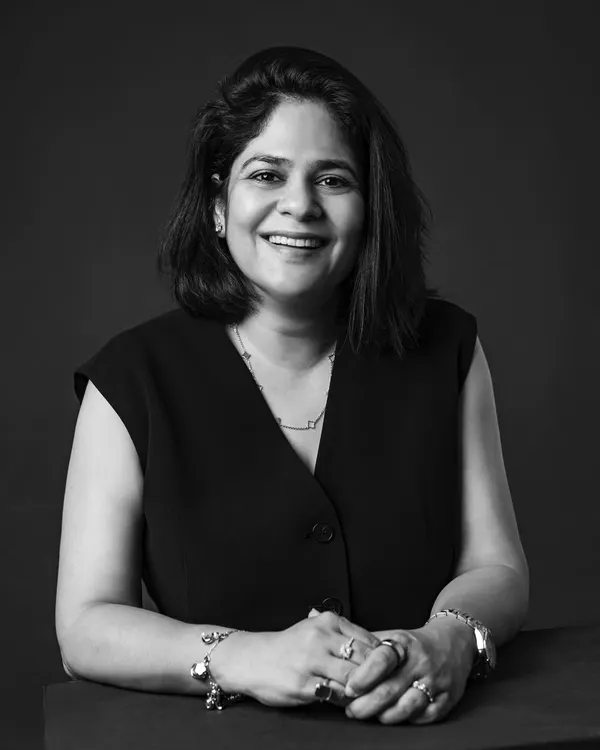 A warm smile and confident posture make for a perfect professional headshot. This classic black and white portrait was taken in my studio, using simple lighting to focus on her expression.