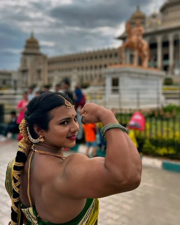 This is me, a proud Kannadathi, in front of the Vidhana Soudha. This photo captures my essence: blending the strength of a bodybuilder with the grace of our tradition. True power is embracing all parts of who you are.