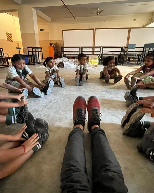From my perspective, leading a flexibility game where students stretch to touch their toes. This group stretching activity helps improve hamstring and lower back flexibility while fostering a sense of unity.