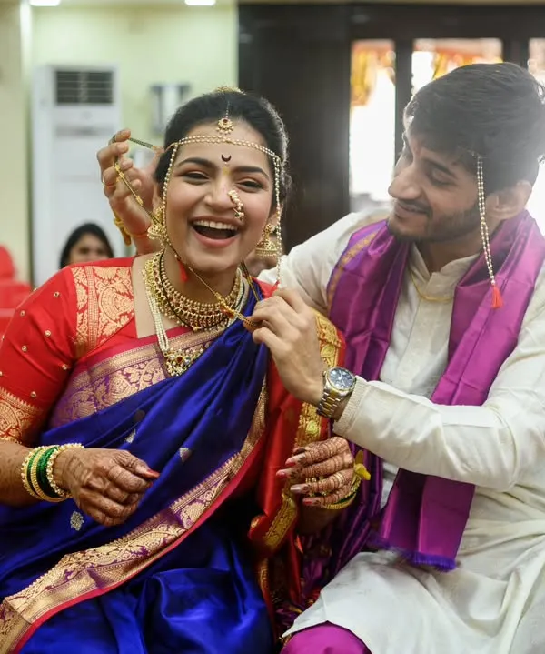 The mangalsutra moment isn't always easy, and that's what makes it real. The pure, uninhibited laughter from Sanika and Shubhankar is what I love about weddings. It's about pure love and fun, not perfection.