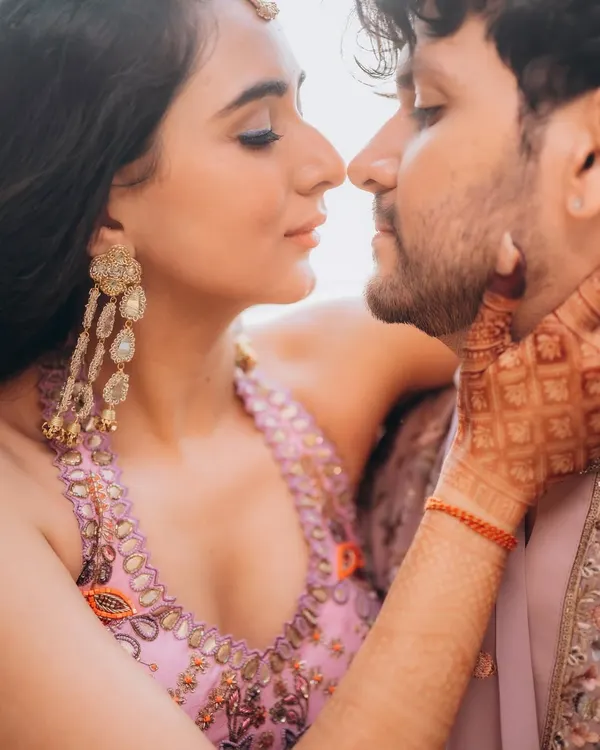 A quiet, intimate close-up of Rupanshi and Yash. This type of shot focuses on the subtle connection and tenderness between a couple.