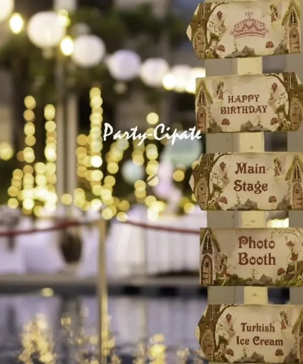 The little details make an event truly personal. For this enchanted forest themed birthday party, we created a custom wooden signpost to guide guests to the main stage and photo booth. Set against the poolside with twinkling lights, it added a touch of whimsy and practicality to the celebration.
