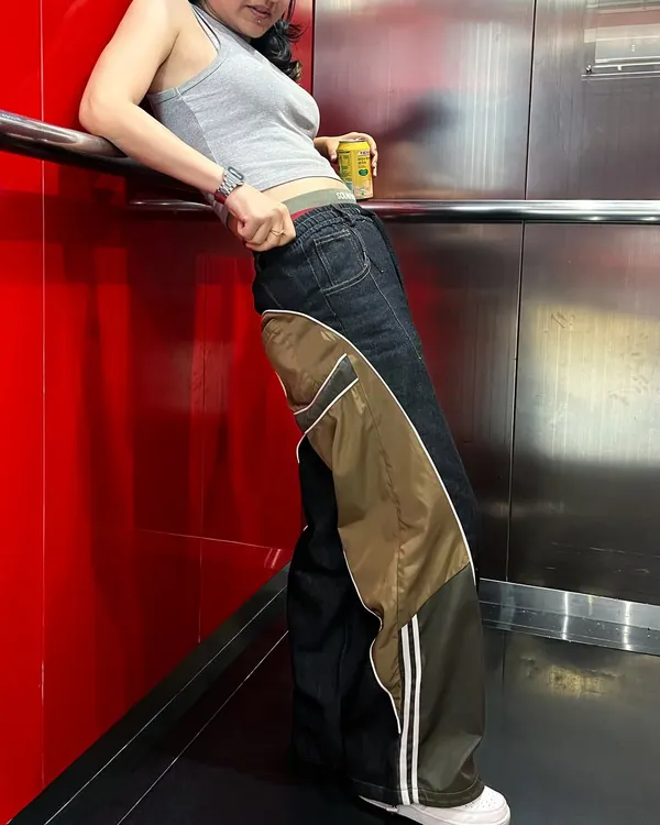 Here's a look at my custom unisex pants, designed with a wide-leg silhouette. I combined dark denim with contrasting nylon panels and athletic stripes to create a unique streetwear staple.