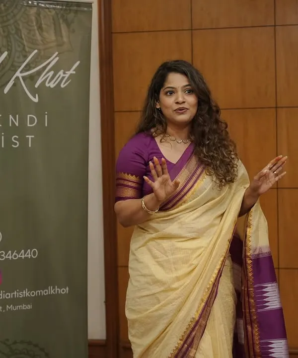 A photo of me during a seminar, sharing my passion for mehendi art with aspiring artists. I love teaching and helping others grow in this beautiful craft.