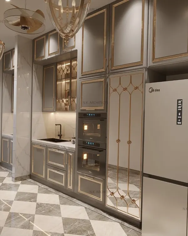 A different angle of our serene and elegant kitchen. This view highlights the built-in ovens, the custom mirrored pantry door with golden iron detailing, and the beautiful chequered marble floor.