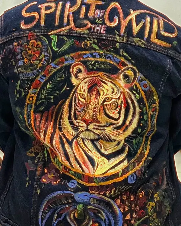 This is what happens when your denim jacket becomes your canvas. In our fabric painting workshops, we guide you to create bold, wearable art like this "Spirit of the Wild" piece, giving your clothing a unique and personal touch.