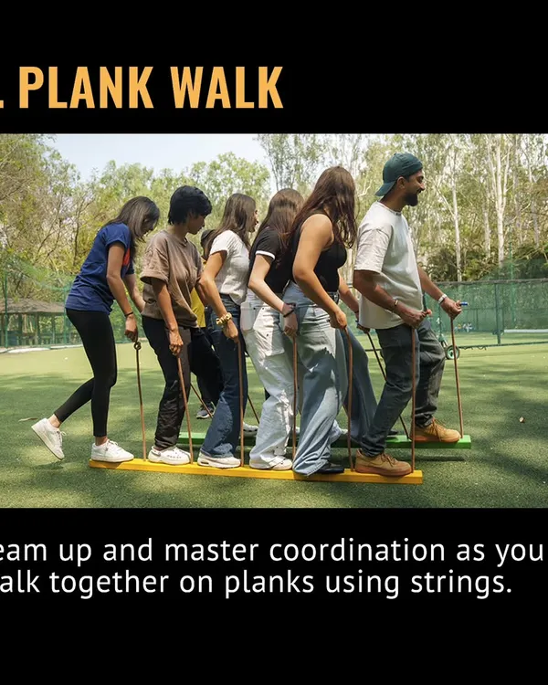 This is the Plank Walk, a new team-building game. Your team has to master coordination to walk together on planks using only strings. It's harder than it looks!