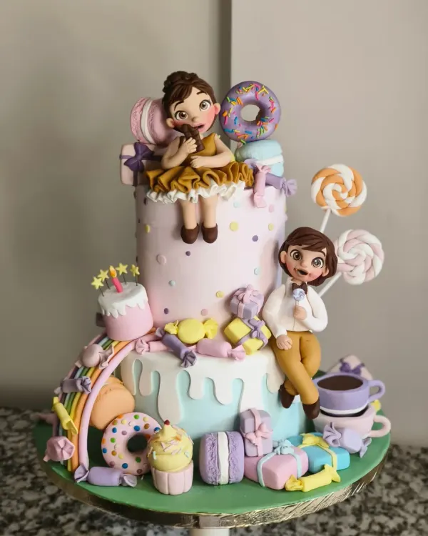 This Candyland themed cake was an absolute joy to make. The design features two tiers of cake adorned with handcrafted fondant characters, donuts, macarons, and candies, creating a vibrant and playful centerpiece for a twin's birthday party.