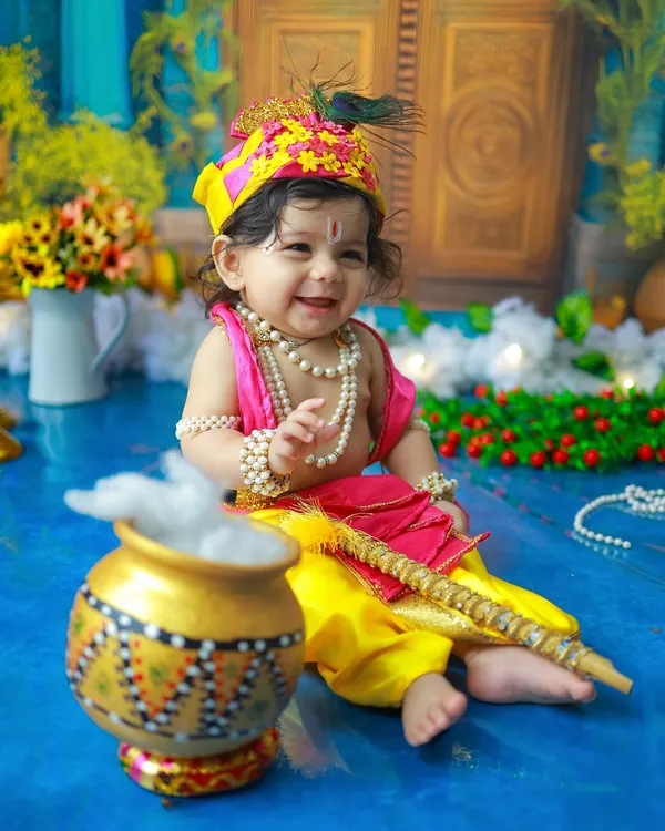 This joyful smile is the essence of a Little Krishna shoot. Dressed in yellow silk with a peacock feather, this baby's happiness is truly divine. It is my absolute favorite kind of magic to create.