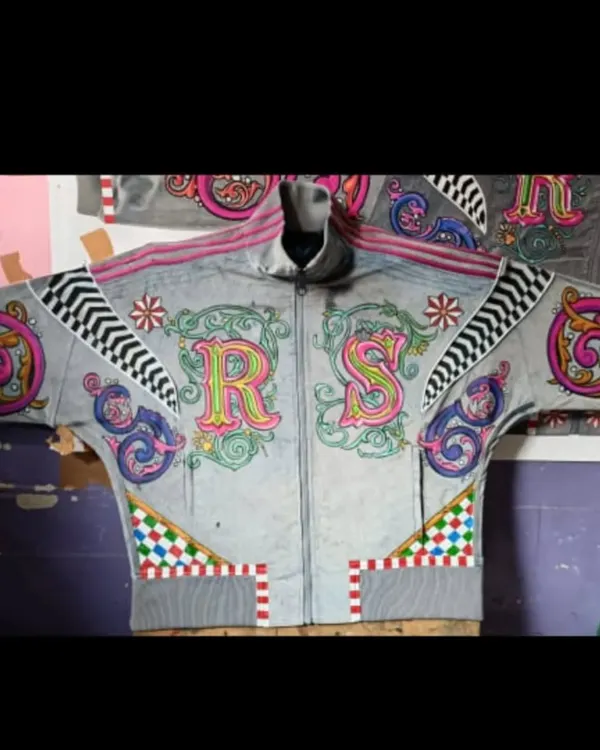This is the front view of a custom hoodie I designed, featuring the initials 'R' and 'S' in a highly decorative, multi-colored style. The design incorporates flourishes, checkered patterns, and geometric details for a bold, personalized statement.
