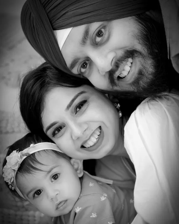 A timeless black and white family portrait that emphasizes pure emotion and connection. This tight embrace shows the beautiful love this family shares.