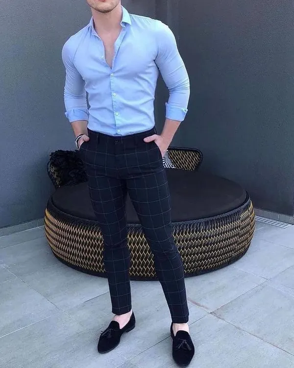 A great example of a smart casual look with a tailored light blue formal shirt and dark checked trousers. I can create custom trousers and shirts that fit you perfectly.