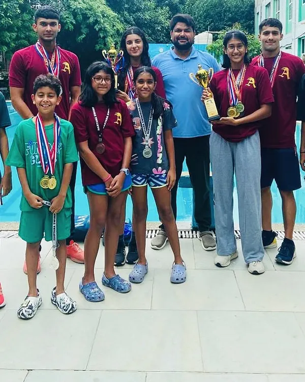 This is what a team of champions looks like. I stand with my swimmers from the Ace Aquatic Academy, showcasing the results of our hard work at a recent Gurugram swim meet: 67 medals from just 7 swimmers, including 32 golds and multiple 'Best Swimmer' trophies.