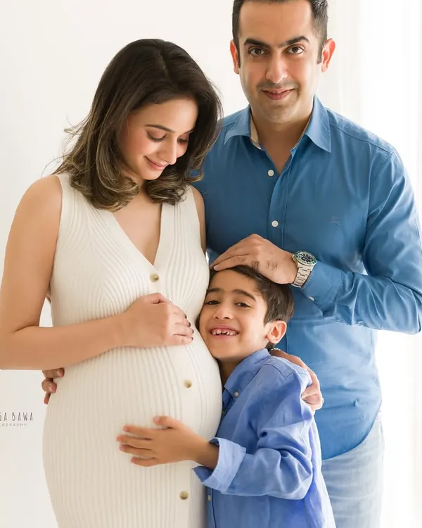There is nothing more beautiful than a big brother's love. We captured this sweet, unprompted hug during a family maternity session, focusing on the bond that's already forming.