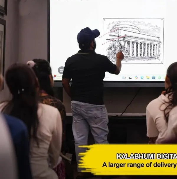 An instructor uses our digital smartboard to teach architectural perspective, a fundamental skill for any aspiring artist or designer.
